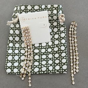 Trina Turk crystal fringe earrings with brass.